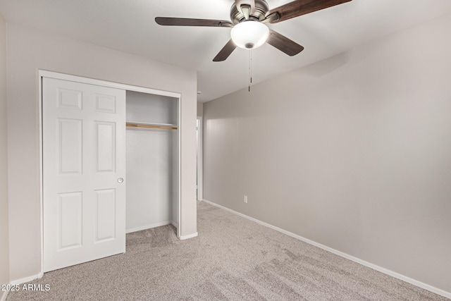 unfurnished bedroom featuring carpet flooring, a closet, and ceiling fan