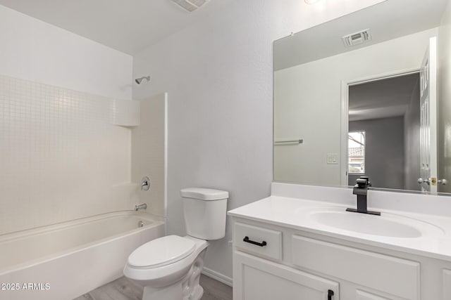 full bathroom with shower / bathtub combination, hardwood / wood-style flooring, toilet, and vanity