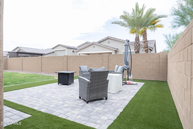 view of patio / terrace featuring a fire pit