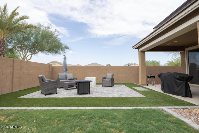 view of yard featuring an outdoor living space with a fire pit and a patio