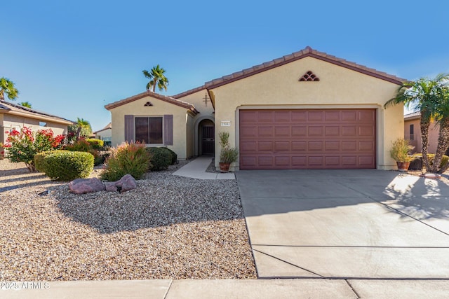 mediterranean / spanish-style home featuring a garage