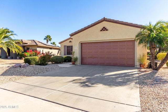 mediterranean / spanish-style home with a garage