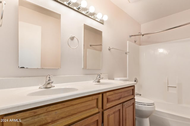 full bathroom with vanity, toilet, and shower / washtub combination