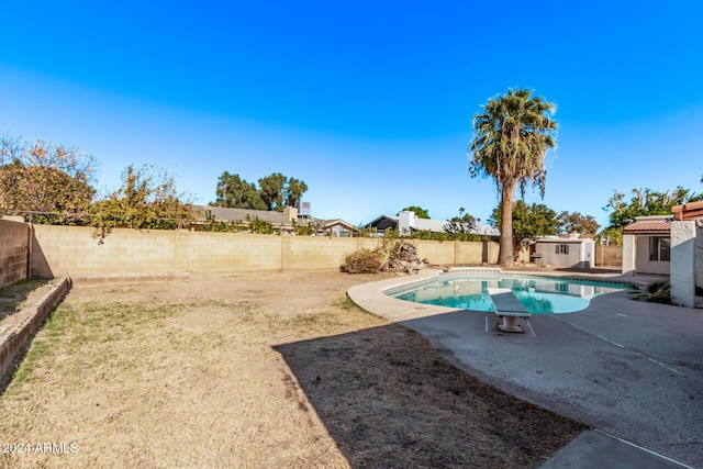 view of pool with a storage unit