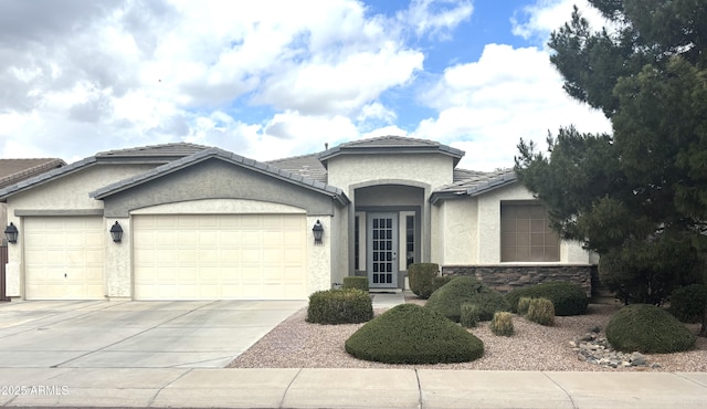 8256 W Bloomfield Rd, Peoria, AZ 85381 - ranch-style home featuring an attached garage, concrete driveway, stucco siding, and a tiled roof