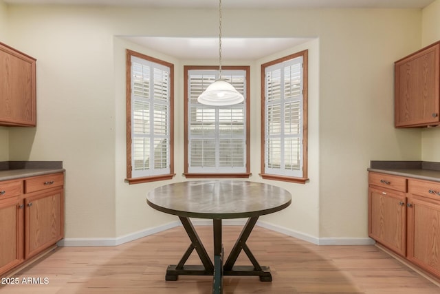 8256 W Bloomfield Rd, Peoria, AZ 85381 - dining area with light wood-style flooring, plenty of natural light, and baseboards
