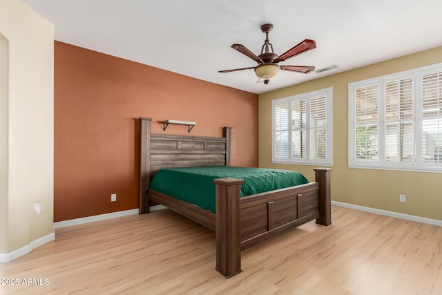 8256 W Bloomfield Rd, Peoria, AZ 85381 - bedroom with light wood-style flooring, baseboards, and ceiling fan