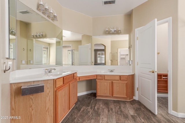 8256 W Bloomfield Rd, Peoria, AZ 85381 - full bath featuring double vanity, wood finished floors, and baseboards