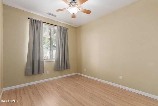 8256 W Bloomfield Rd, Peoria, AZ 85381 - empty room featuring light wood finished floors, baseboards, and ceiling fan