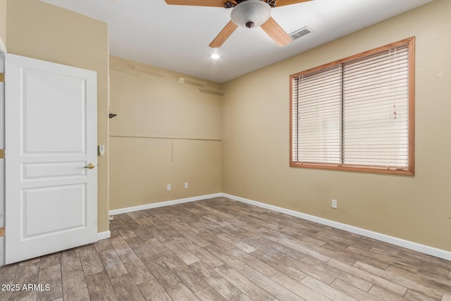 8256 W Bloomfield Rd, Peoria, AZ 85381 - empty room with a ceiling fan, light wood-style flooring, and baseboards