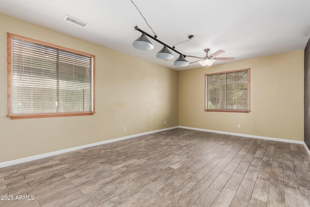 8256 W Bloomfield Rd, Peoria, AZ 85381 - empty room featuring wood finished floors, baseboards, and ceiling fan