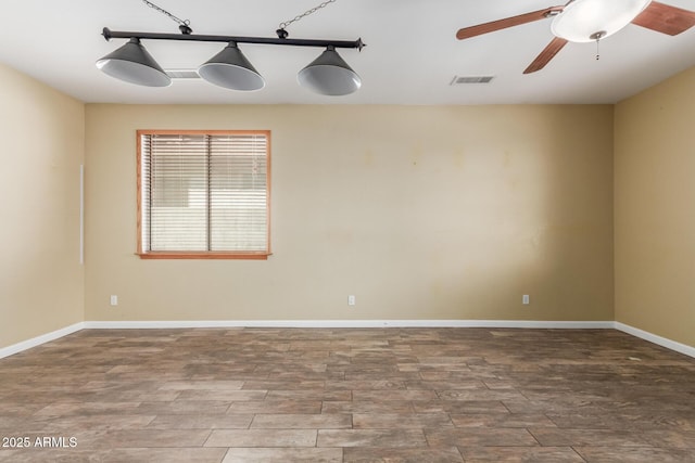 8256 W Bloomfield Rd, Peoria, AZ 85381 - spare room featuring a ceiling fan, wood finished floors, and baseboards