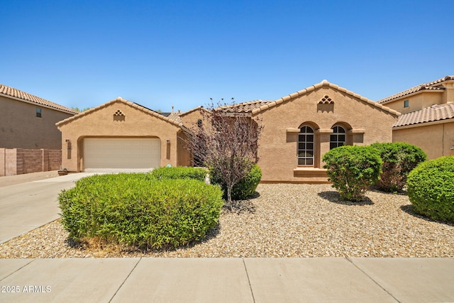 2422 W Maya Way, Phoenix, AZ 85085 - mediterranean / spanish house with driveway, an attached garage, stucco siding, and a tile roof