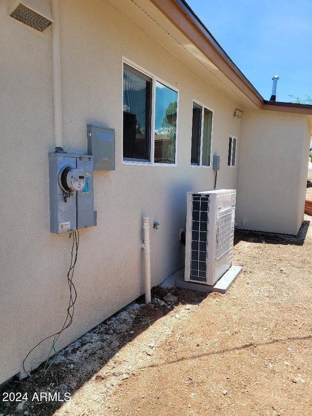 view of property exterior featuring central AC