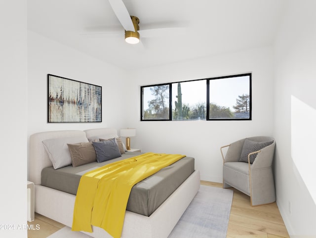 bedroom featuring ceiling fan and light hardwood / wood-style flooring