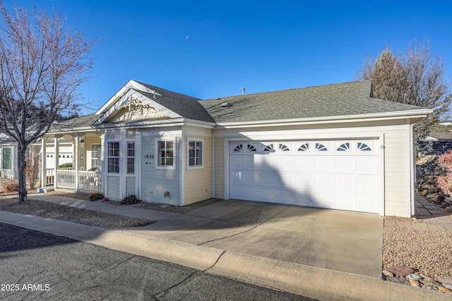 view of front of home with a garage and covered porch