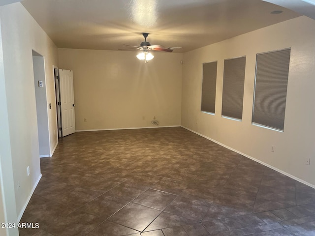 unfurnished room with ceiling fan