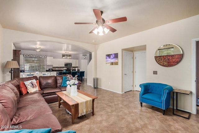 living room featuring ceiling fan and light tile patterned floors