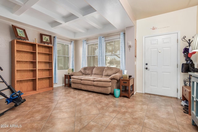 living room featuring light tile patterned floors, beamed ceiling, and coffered ceiling