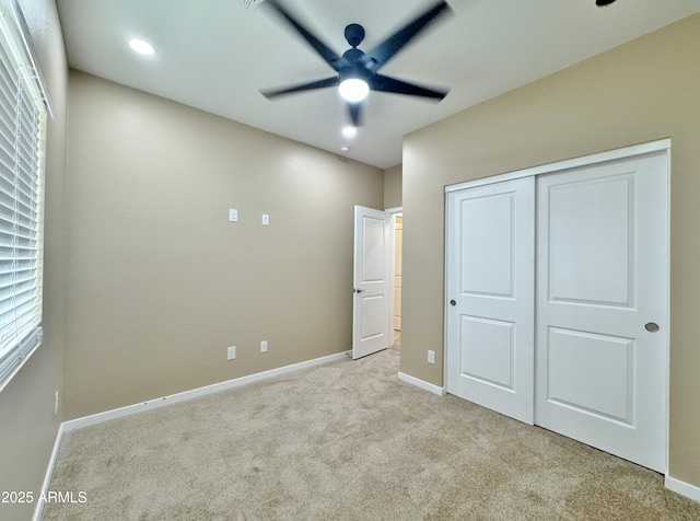 15422 S Sequoia Cir, Arizona City, AZ 85123 - unfurnished bedroom featuring a closet, light colored carpet, baseboards, and ceiling fan