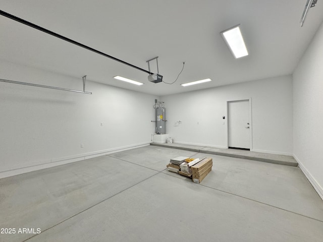 15422 S Sequoia Cir, Arizona City, AZ 85123 - garage with electric water heater, baseboards, and a garage door opener