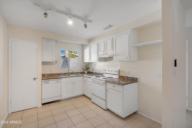 kitchen with white cabinets, light tile patterned flooring, sink, white appliances, and track lighting