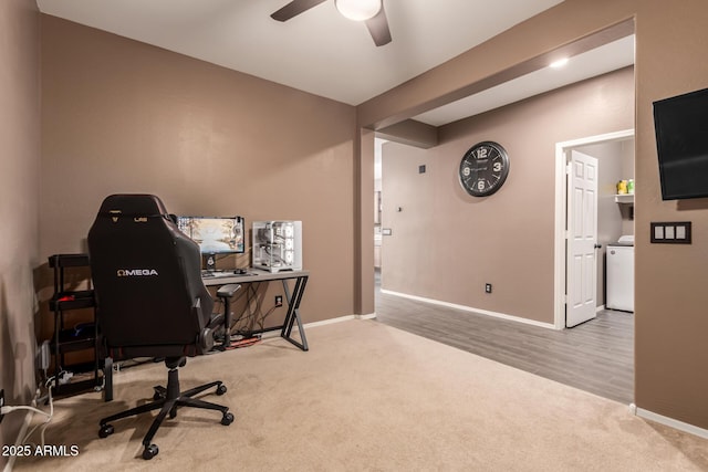 home office with ceiling fan and carpet flooring