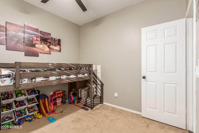 bedroom with ceiling fan and carpet floors