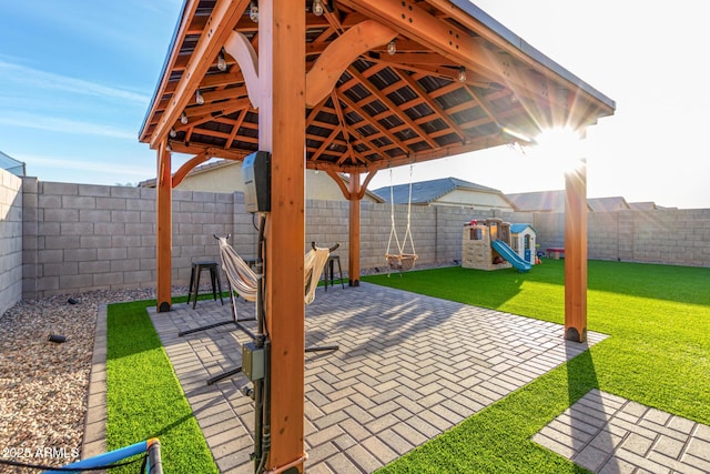 view of patio / terrace featuring a playground and a gazebo