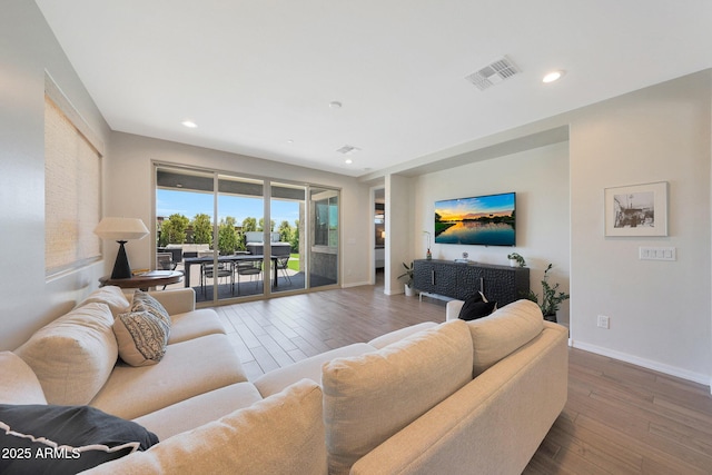 29339 N 135th Dr, Peoria, AZ 85383 - living room with baseboards, wood finished floors, and recessed lighting