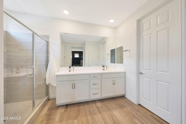 29339 N 135th Dr, Peoria, AZ 85383 - full bathroom featuring wood finished floors, double vanity, a shower stall, and recessed lighting