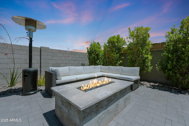 29339 N 135th Dr, Peoria, AZ 85383 - patio terrace at dusk with a fire pit, a patio, and a fenced backyard