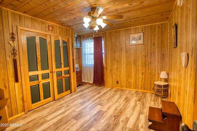 8455 Ridge Dr, Show Low, AZ 85901 - spare room with wooden ceiling, ceiling fan, wooden walls, and wood finished floors