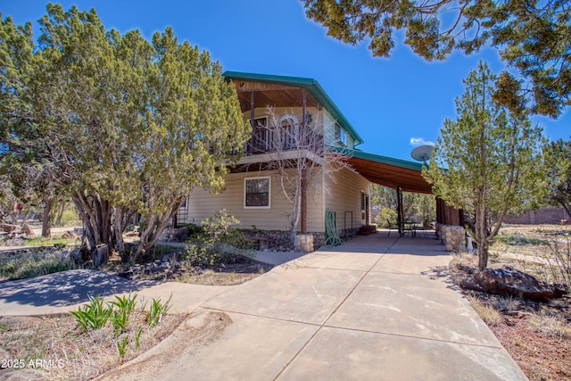 8455 Ridge Dr, Show Low, AZ 85901 - view of home's exterior featuring a carport and driveway