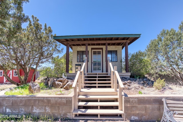 8455 Ridge Dr, Show Low, AZ 85901 - view of front facade featuring covered porch and stairway