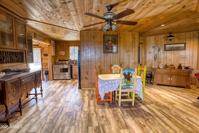 8455 Ridge Dr, Show Low, AZ 85901 - dining room featuring wood ceiling, wood walls, ceiling fan, and light wood finished floors