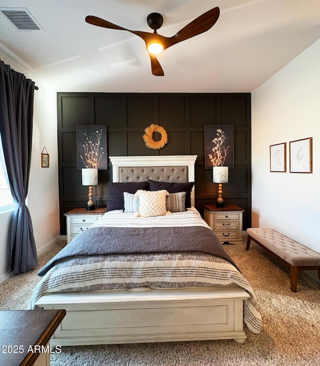 bedroom featuring carpet, visible vents, baseboards, and ceiling fan