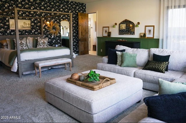 carpeted bedroom featuring wallpapered walls