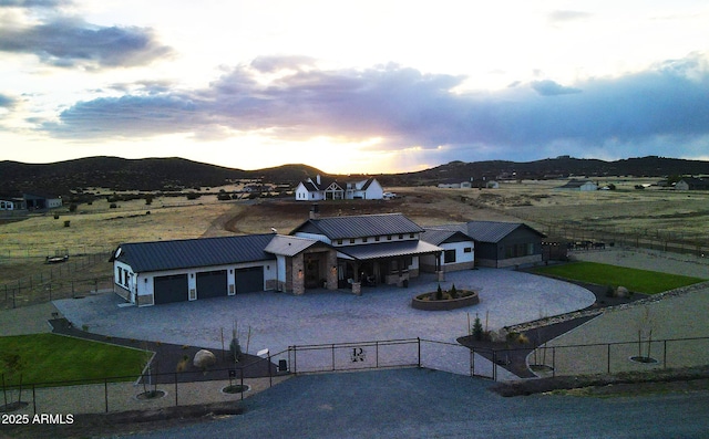 drone / aerial view featuring a rural view and a mountain view