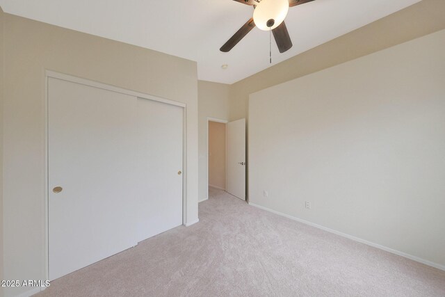 2627 E Gary Way, Phoenix, AZ 85042 - unfurnished bedroom featuring light colored carpet, a closet, and ceiling fan