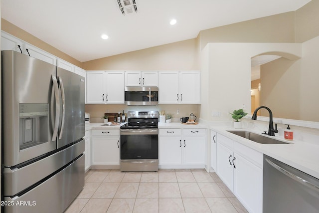 2627 E Gary Way, Phoenix, AZ 85042 - kitchen featuring appliances with stainless steel finishes, a sink, lofted ceiling, light countertops, and white cabinets