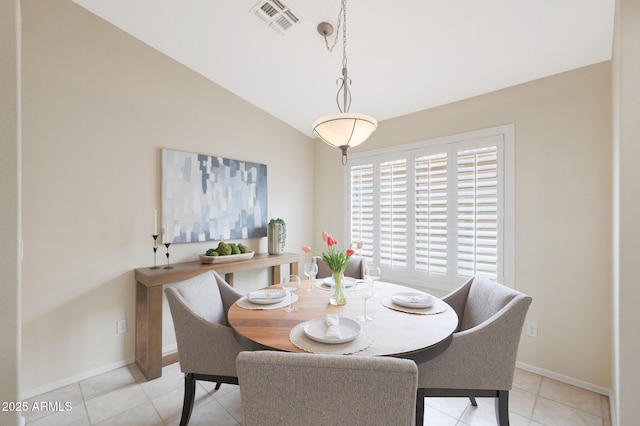 2627 E Gary Way, Phoenix, AZ 85042 - dining space with baseboards, vaulted ceiling, and light tile patterned floors