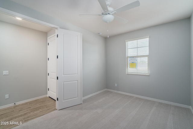 unfurnished bedroom featuring ceiling fan and baseboards