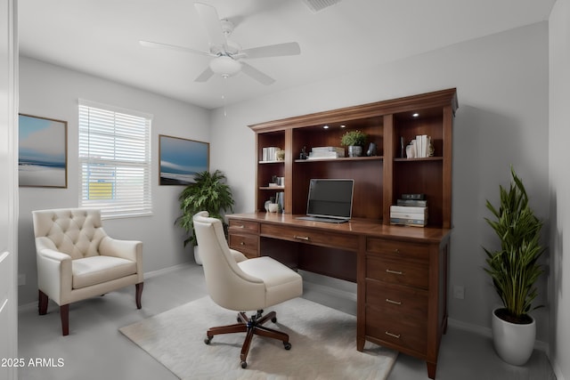 office space with ceiling fan and baseboards