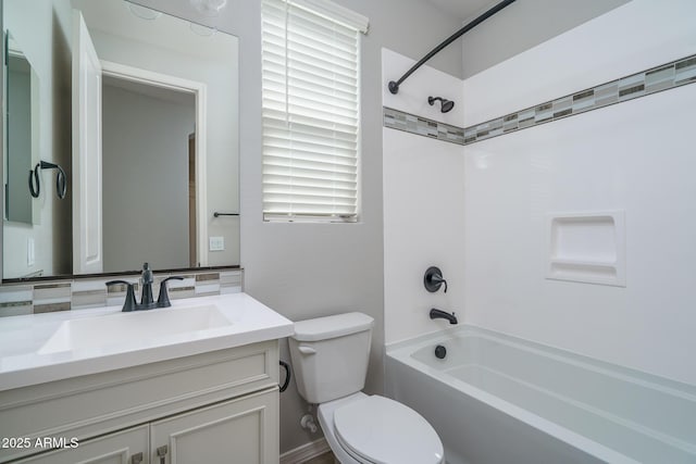 bathroom with  shower combination, vanity, and toilet