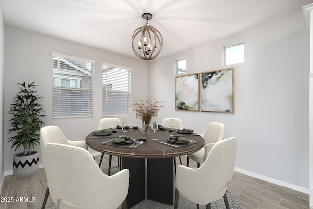 dining room featuring plenty of natural light, wood finished floors, and baseboards