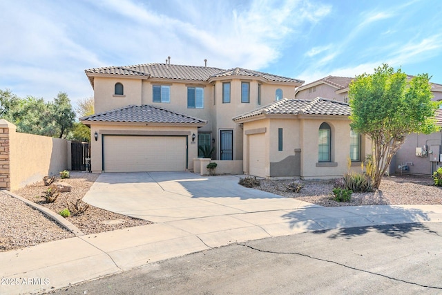 4389 E Muirfield St, Gilbert, AZ 85298 - mediterranean / spanish home with a tiled roof, stucco siding, fence, a garage, and driveway
