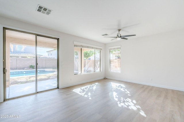 4389 E Muirfield St, Gilbert, AZ 85298 - empty room with light wood-style flooring, ceiling fan, baseboards, and visible vents