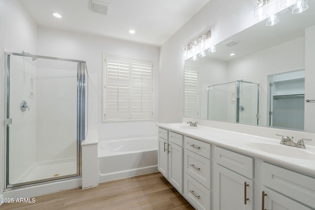4389 E Muirfield St, Gilbert, AZ 85298 - full bath with a sink, a bath, a shower stall, and wood finished floors