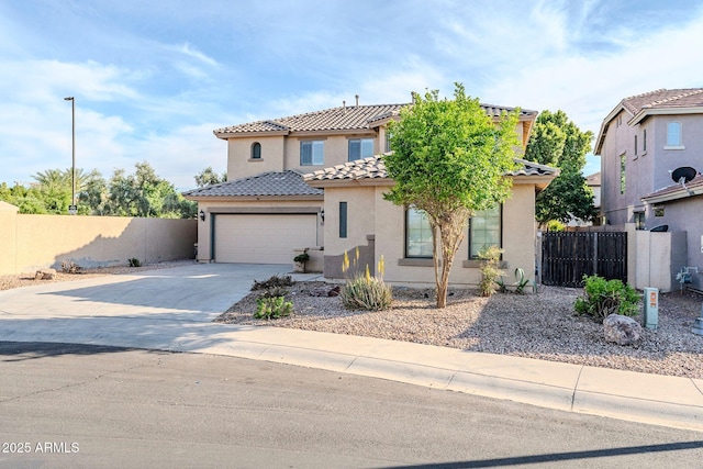4389 E Muirfield St, Gilbert, AZ 85298 - mediterranean / spanish home featuring concrete driveway, stucco siding, an attached garage, a tiled roof, and fence